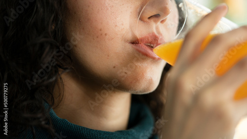 Bild auf Leinwand Young woman drinking orange juice