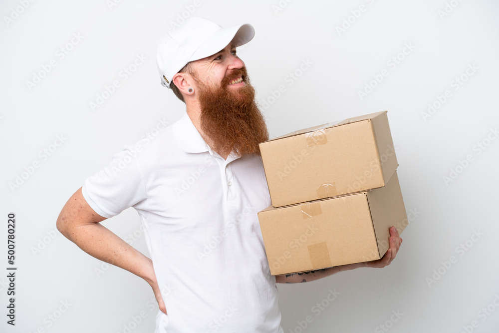 Delivery reddish man isolated on white background looking side Delivery reddish man isolated on white background looking side