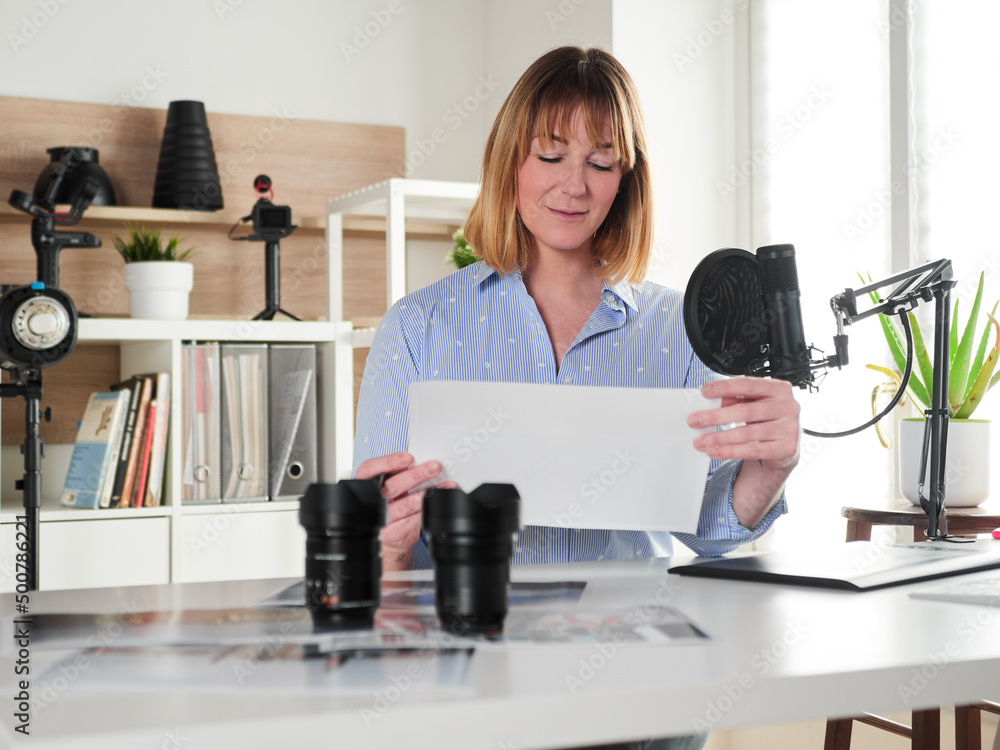 Female photographer working at office studio Female photographer working at office studio