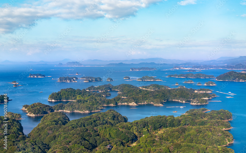 Beautiful bird's-eye view of a seascape of the Kujūkushima islands that lie off sasebo famous for its saw-toothed coast with multiple islets part of Saikai National Park in Kyushu. Beautiful bird's-eye view of a seascape of the Kujūkushima islands that lie off sasebo famous for its saw-toothed coast with multiple islets part of Saikai National Park in Kyushu.