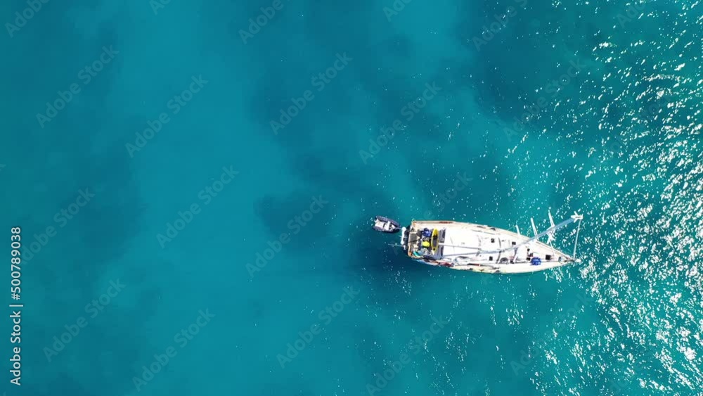 flying over the great barrier reef in the whitsundays, over a yacht, in queensland, Australia flying over the great barrier reef in the whitsundays, over a yacht, in queensland, Australia
