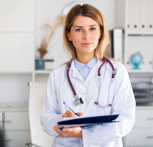 adult doctor female working in uniform in room photo