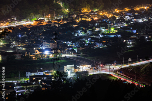 Overhead view of intersection in quiet village at night