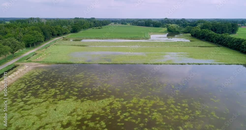 Aerial view of flooded floodplains of river Maas with trees, Megen, Netherlands. Aerial view of flooded floodplains of river Maas with trees, Megen, Netherlands.
