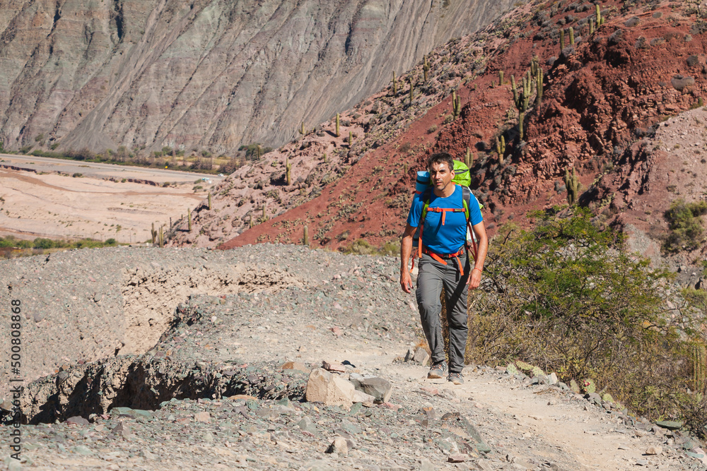 Adult man takes a hike through the mountains of northern Argentina