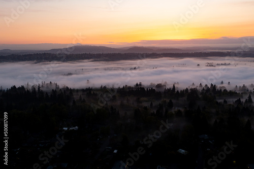 Dawn illuminates a layer of fog that covers the scenic Willamette River not far south of Portland, Oregon. This beautiful part of the Pacific Northwest receives lots of moisture annually. © ead72