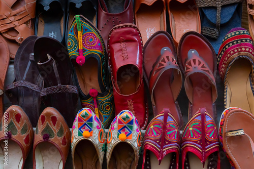 Pairs of Rajasthani womens' shoes at display for sale. Jaisalmer, Rajasthan, India.