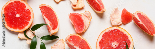 Fotografija Pieces of fresh grapefruit on white background. Banner for design