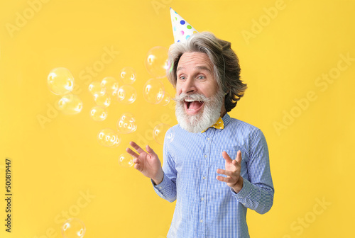 Happy senior man with big h...