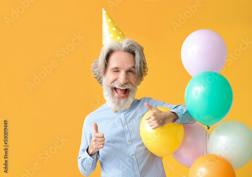 Happy senior man with big h...