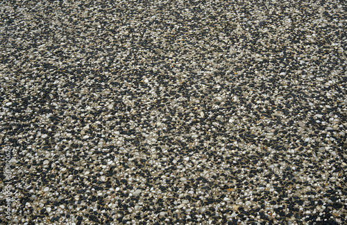 Exposed aggregate concrete driveway close up view