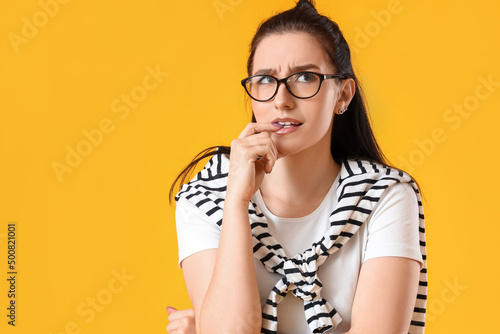 Worried young woman on yell...