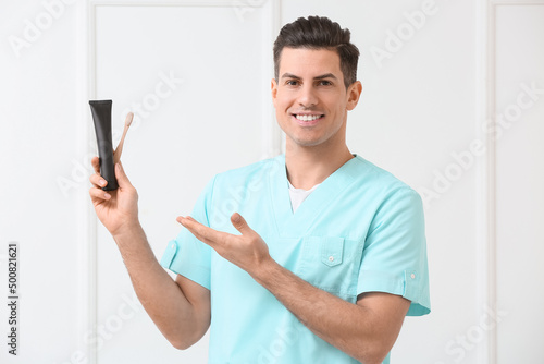 Male dentist with activated...