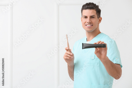 Male dentist with activated...