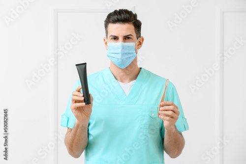 Male dentist with activated...
