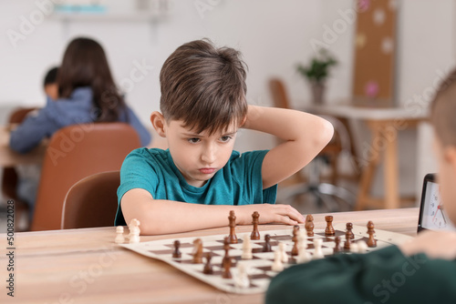 Little children playing che...