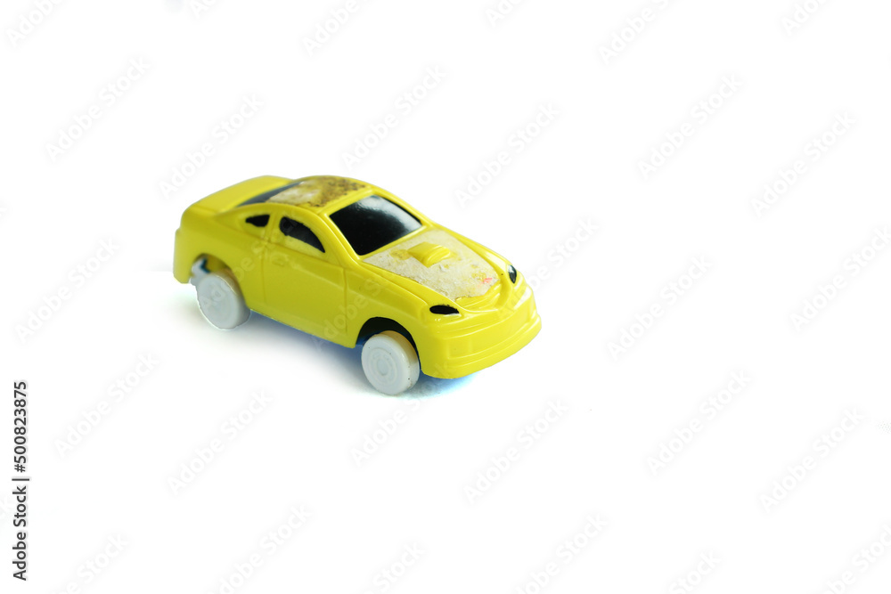 Close-Up Of Children's toy Car On White Background. Close-Up Of Children's toy Car On White Background.