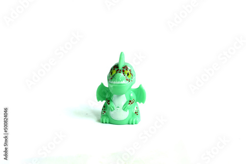 side view green dragon plastic toy isolated on white background.