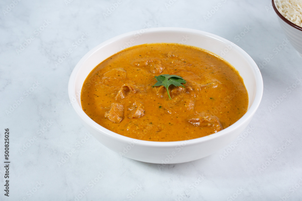 A view of a bowl of chicken tikka masala. A view of a bowl of chicken tikka masala.