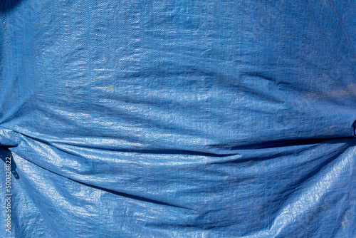 A view of a blue tarp, as a background. photo