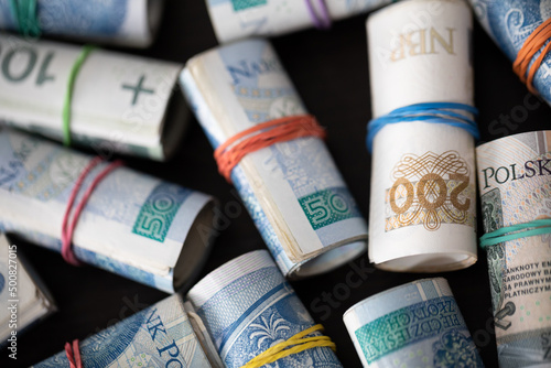 Banknotes rolled up. Different denominations of the Polish national currency.