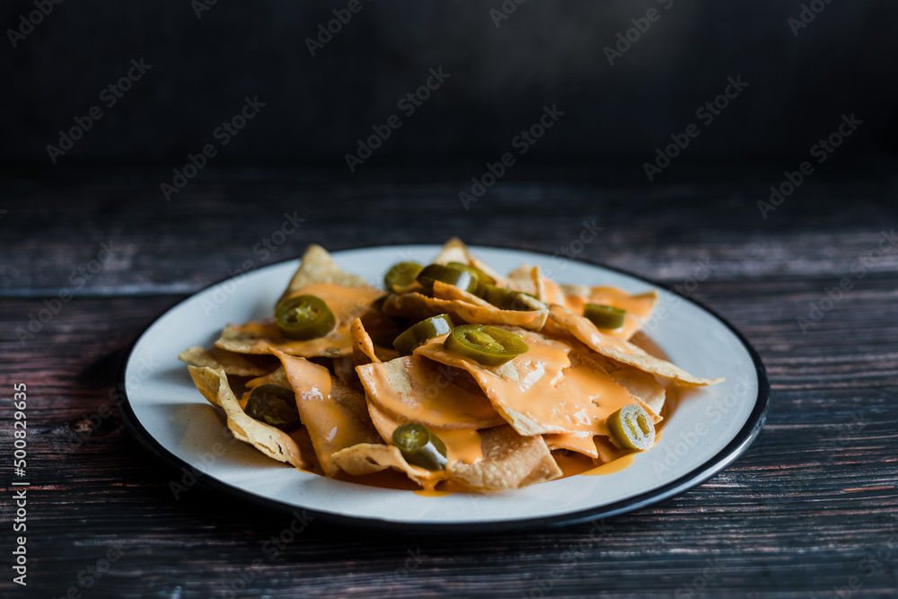 Mexican nachos chips with american cheese, beer and jalapeños in Mexico Latin America Mexican nachos chips with american cheese, beer and jalapeños in Mexico Latin America