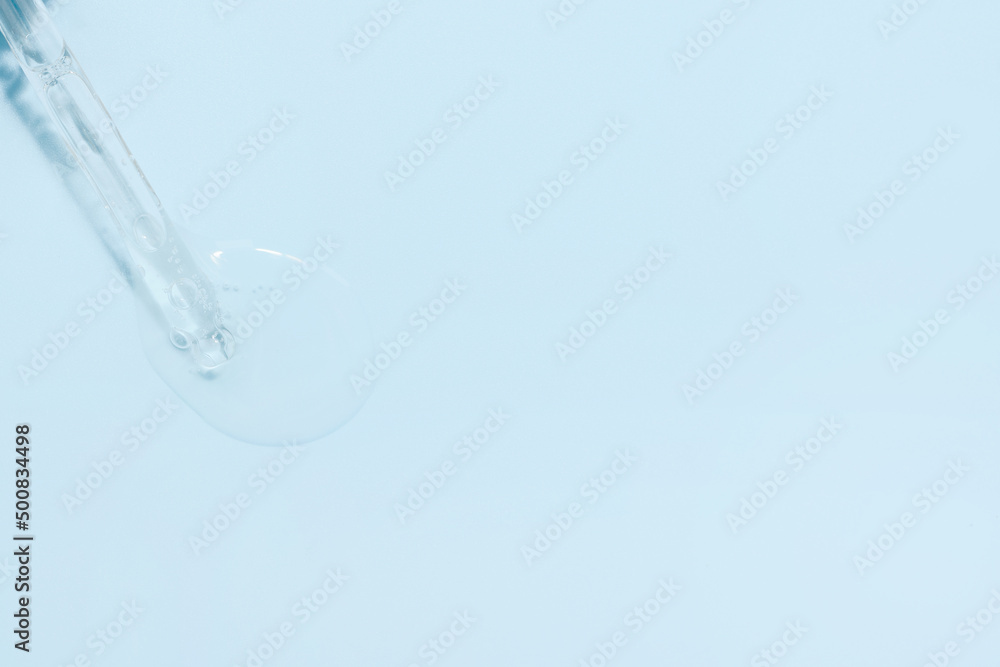 Liquid transparent hyaluronic or retinol serum or gel with vitamin c on a blue background. Open the lid of the serum dropper. Light background with daylight and gel texture look. Skin care products Liquid transparent hyaluronic or retinol serum or gel with vitamin c on a blue background. Open the lid of the serum dropper. Light background with daylight and gel texture look. Skin care products