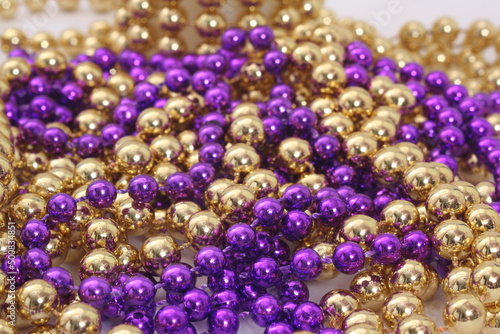 Purple and Gold Holiday Bead Decortations. Christmas Background