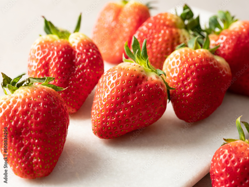 fresh strawberries on a white plate