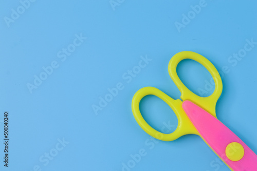Scissors isolated on a blue background. School and office supplies