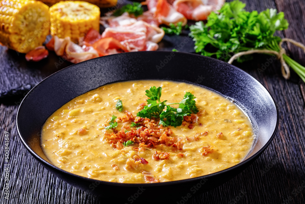 corn chowder in bowl on table, top view corn chowder in bowl on table, top view