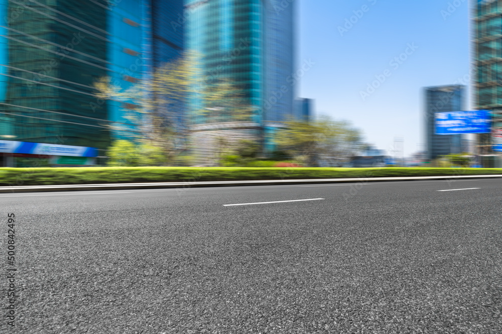 empty asphalt road with shanghai city skyline background in china