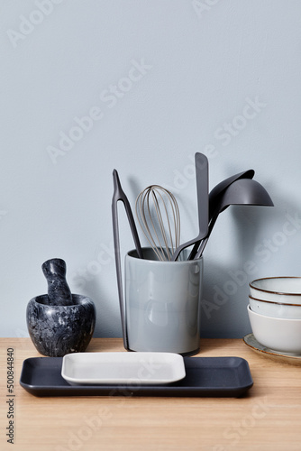 Image of kitchenware with little trays and bowls preparing for cooking on table