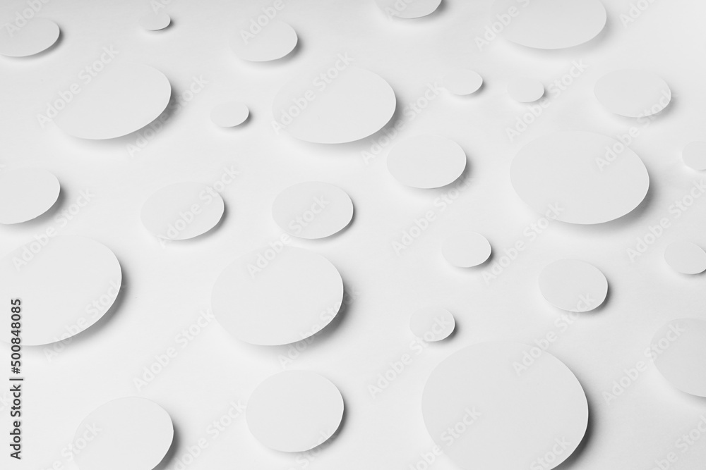 Geometric pattern of white ovals in shine light with soft shadows in random, top view. Minimalist modern calm tender abstract background.