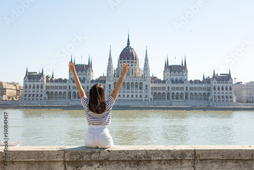 smiling woman portrait in front of Budapest parliament building