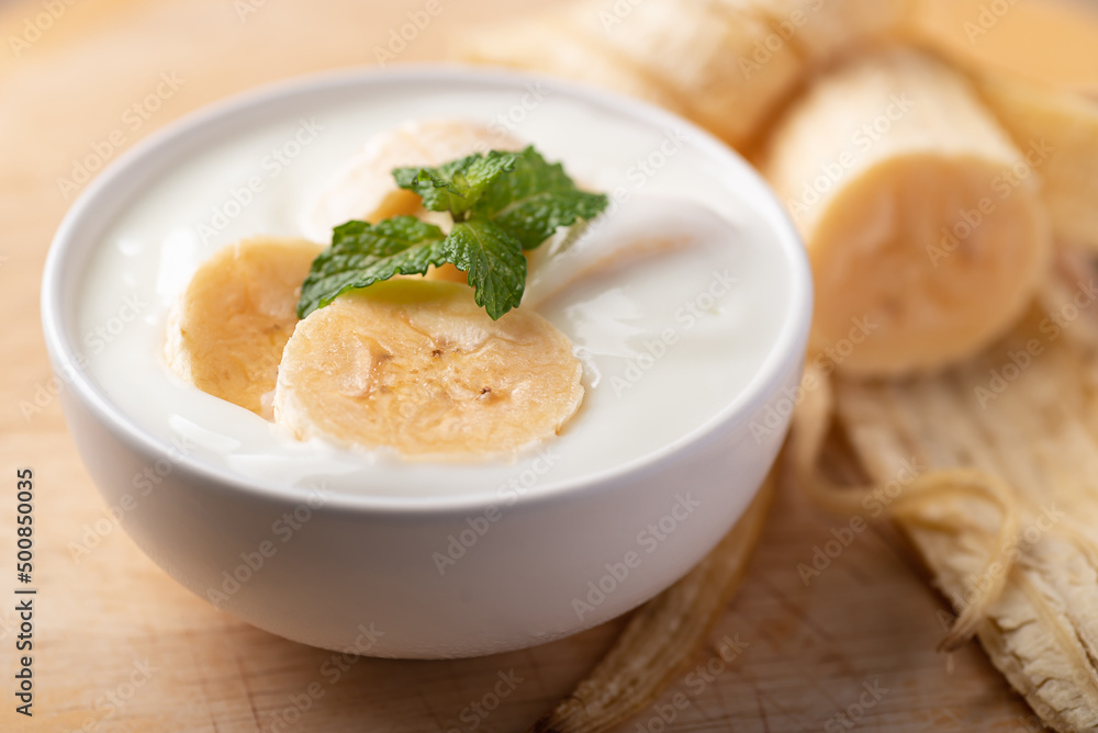Yogurt with banana in bowl, Healthy eating Yogurt with banana in bowl, Healthy eating