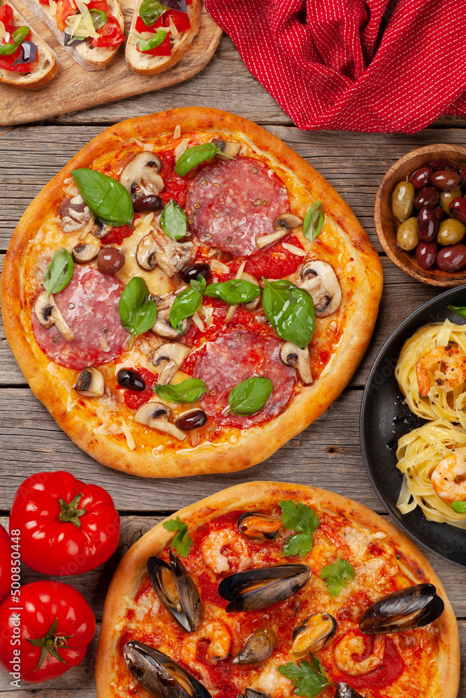 Italian cuisine. Pizza, pasta and toasts Italian cuisine. Pizza, pasta and toasts