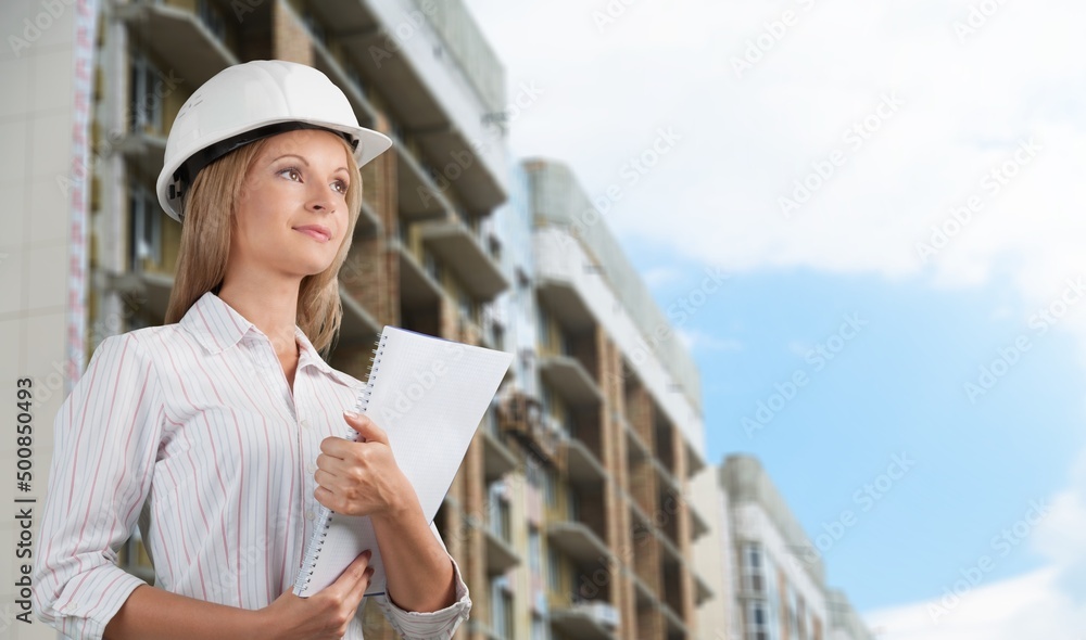 Woman engineer architect worker holding blueprint construction Woman engineer architect worker holding blueprint construction