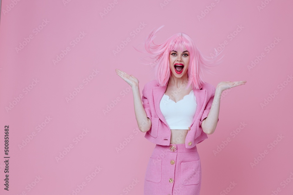 Beautiful fashionable girl bright makeup pink hair glamor pink background unaltered Beautiful fashionable girl bright makeup pink hair glamor pink background unaltered