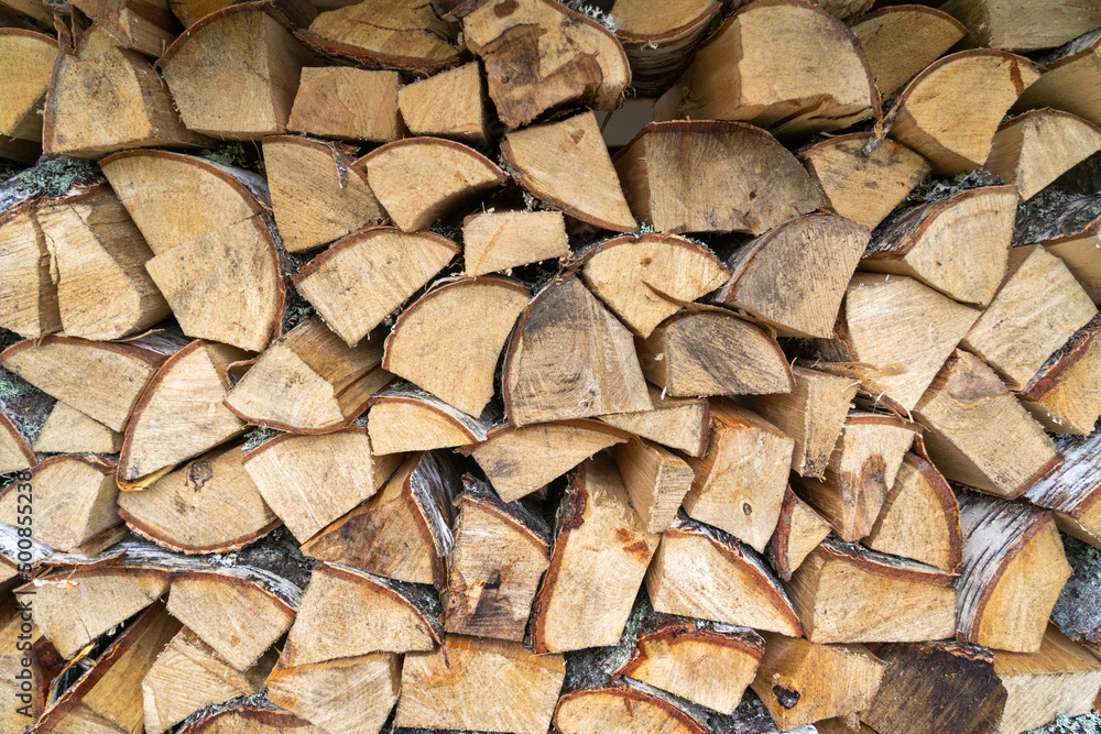 View of a stack of firewood. Backround. View of a stack of firewood. Backround.