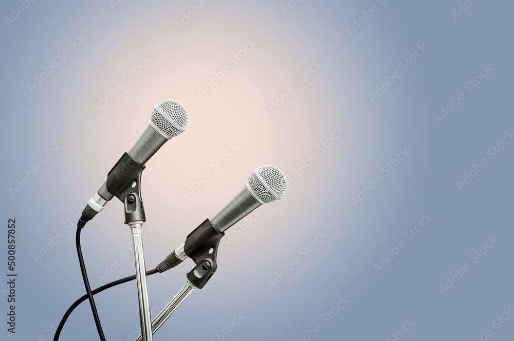 Obraz premium two microphone blue background