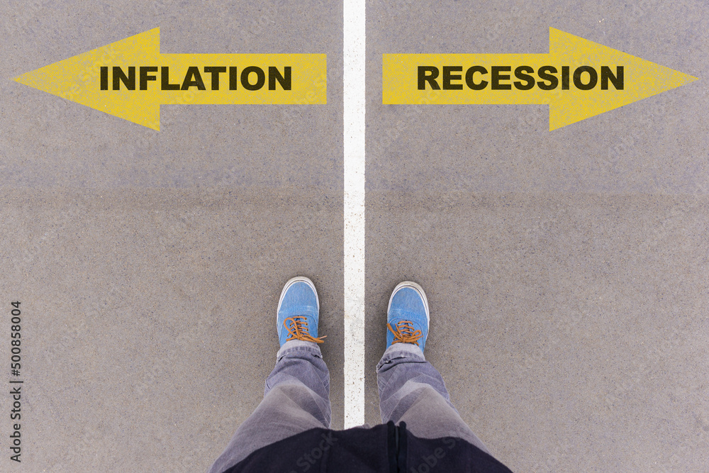 Inflation or recession choice, text on asphalt ground, feet and shoes on floor