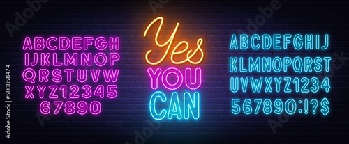 Yes You Can neon lettering on brick wall background.