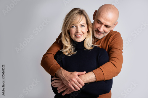 Happy mature couple studio portrait
