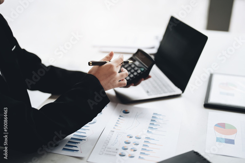 Vászonkép accountant, Auditor, Self-Employed, Finance and Investment, tax calculation and budget, Asian female entrepreneur using a calculator to calculate