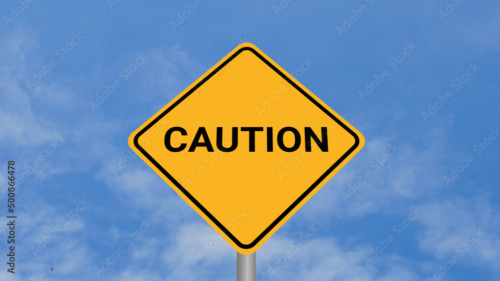 Caution Road Sign on Clear Blue Sky with Rapid Moving Clouds for Text Placement Caution Road Sign on Clear Blue Sky with Rapid Moving Clouds for Text Placement