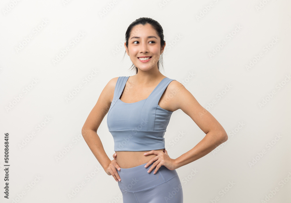 Young beautiful asian woman with sportswear on isolated white background. Portrait sporty woman standing pose exercise workout in studio. Young beautiful asian woman with sportswear on isolated white background. Portrait sporty woman standing pose exercise workout in studio.