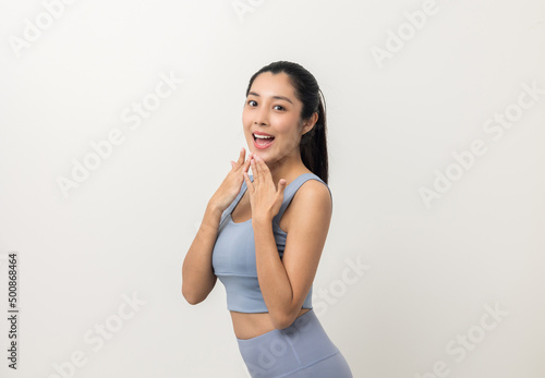 Young beautiful asian woman with sportswear on isolated white background. Portrait sporty woman standing pose exercise workout in studio.