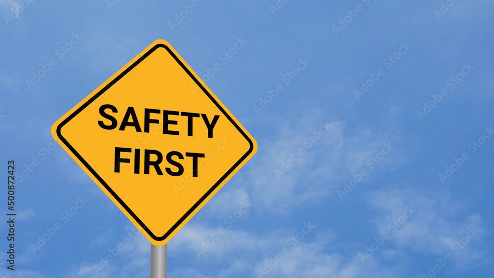 Safety First Road Sign on Clear Blue Sky with Rapid Moving Clouds for Text Placement Safety First Road Sign on Clear Blue Sky with Rapid Moving Clouds for Text Placement