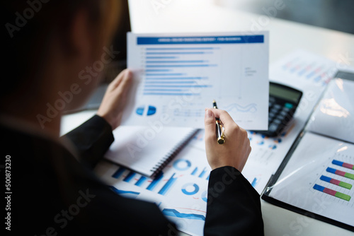 data analysis, plan, marketing, accounting, audit, asian business woman holding pen of planning marketing using statistical data sheet and calculator to present marketing plan project at meeting.